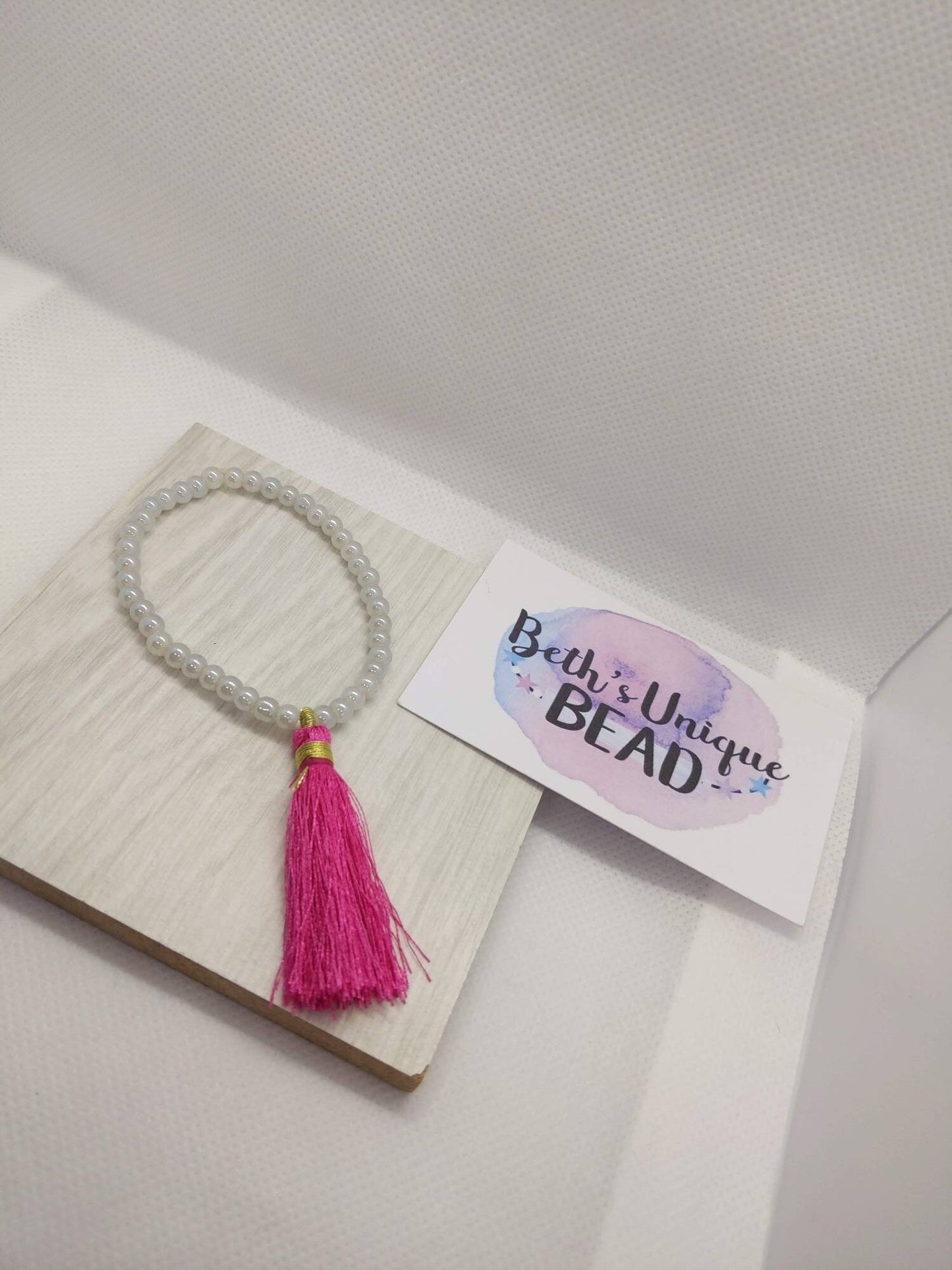 Beaded bracelet, tassel bracelet, gold bangle, pink bangle, white round beads, expandable arm candy